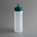 a plastic bottle with a green lid