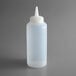 A clear plastic bottle with a white cap.