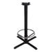 A Lancaster Table & Seating black cast iron bar height table base with a round metal foot ring.