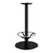 A Lancaster Table & Seating black cast iron bar height table base with a round metal foot ring.