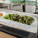 A white G.E.T. Enterprises Bugambilia rectangular platter with a salad in a bowl on ice.