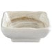 A white square bowl with a brown speckled pattern.