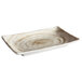 A white rectangular plate with a brown swirl pattern on the rim.