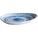 A close up of a blue and white Elite Global Solutions Van Gogh Oval Melamine Plate with a swirl design.