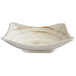 A white bowl with a brown square design.