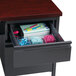 A charcoal left corner pedestal desk with a drawer and file cabinet full of stationery.