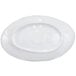 An oval white melamine plate with a navy blue Van Gogh design on the rim.