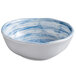 A white melamine bowl with blue swirls.