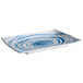 A white rectangular plate with blue swirls on it.