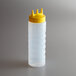 A clear plastic Vollrath Tri Tip squeeze bottle with a yellow cap.