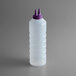 a plastic bottle with a purple cap