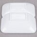 A white foam container holding two white rectangular melamine sauce dishes.