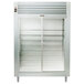 A Traulsen stainless steel reach-in refrigerator with glass doors.