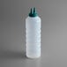 A plastic bottle with a green cap.