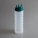 A clear plastic Vollrath Tri Tip squeeze bottle with a green cap.
