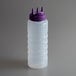 A white plastic squeeze bottle with a purple Tri Tip cap.