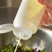 a close-up of a liquid pouring into a container