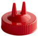 a red plastic cap with two pointy tops