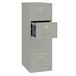 A gray Hirsh Industries vertical legal file cabinet with four drawers, one open.