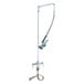 A T&S pre-rinse faucet with a flex hose attached to a metal pipe.