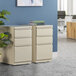 A white Hirsh Industries mobile pedestal letter file cabinet with drawers.