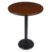 a brown table with a black base