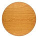 A round, 30-inch reversible walnut and oak table top with a bar height cast iron base.
