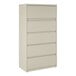 A putty-colored five-drawer lateral file cabinet with roll-out binder storage.