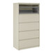 A five-drawer putty-colored lateral file cabinet with a roll-out binder storage compartment at the top.