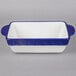 A white rectangular china casserole dish with cobalt blue accents.