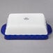 A white rectangular casserole dish with cobalt blue accents.