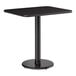A rectangular black standard height table with a single pedestal and round cast iron base.