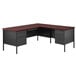 A charcoal and mahogany corner desk with two drawers.