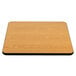 A close-up of a Lancaster Table & Seating square table with a reversible walnut and oak wood surface.