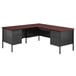 A black and walnut Hirsh Industries left corner pedestal desk with two drawers.