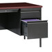 A black Hirsh Industries left corner pedestal desk with a drawer and file cabinet.