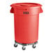 A Lavex red plastic trash can with wheels.