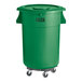 A Lavex green plastic trash can with wheels and a lid.