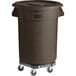 A brown plastic Lavex trash can with wheels.