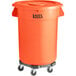 An orange Lavex commercial trash can with wheels and a black lid.