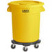 A yellow Lavex trash can on wheels.