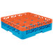 A blue and orange plastic Carlisle glass rack with holes.