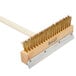 A Chef Master pizza oven brush with a wooden handle and gold bristles.