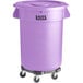 A purple plastic Lavex trash can with wheels.