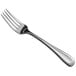 a silver fork on a white background