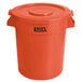 An orange Lavex round commercial trash can with lid.