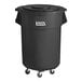 A black plastic Lavex commercial trash can with wheels.