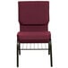 A burgundy church chair with a metal frame.