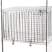 A Metro Super Erecta security module with metal wire shelves and a metal cage.