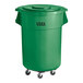 A green plastic Lavex trash can with wheels.